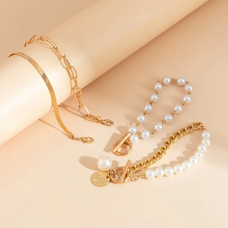 Elegantes 4-teiliges Armbandset in Gold – Schlange, Perlen & Glieder - Image 5