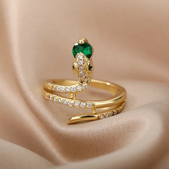 Schlangenring in Brillantgold mit grünen Kristallen